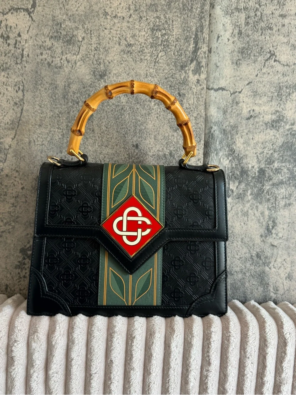 Black Satchel with Bamboo Top Handle and Green-Gold Stripe Accent